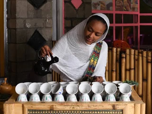 Traditional coffee being poured into small cups